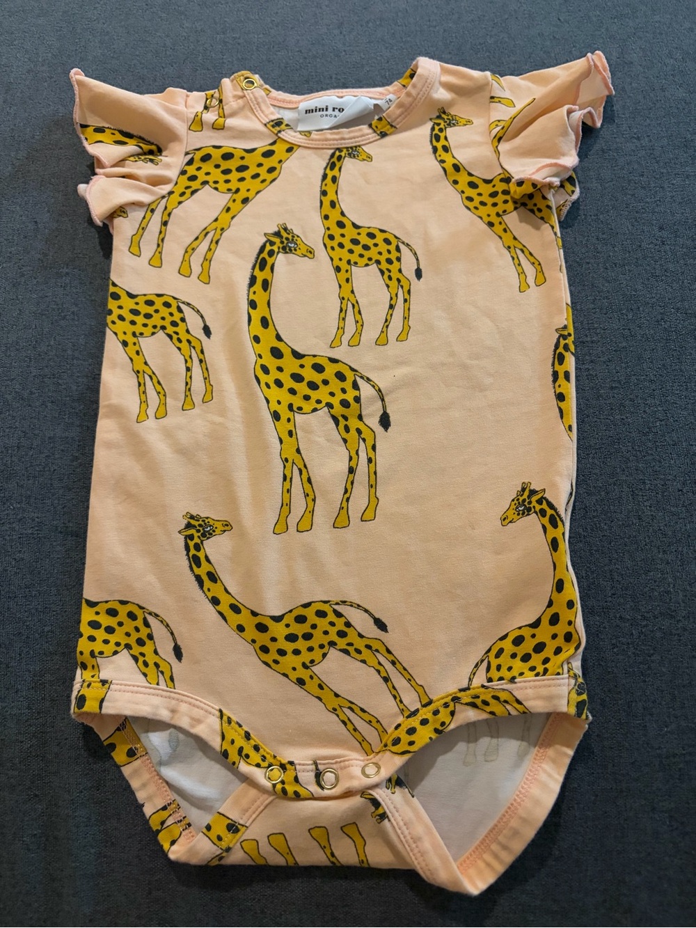 Mini Rodini Peach Bodysuit with Yellow Giraffe Print
